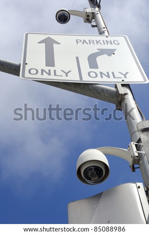 Surveillance cameras mounted on the street pole to oversee street traffic
