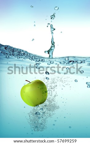 Green apple splashing into water