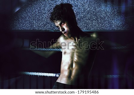 Man crying in boxing ring
