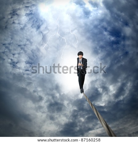 Business man run on the rope high in the sky