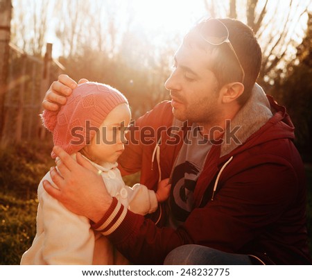 Vintage color photo,father talks to his daughter, father\'s day - concept. Sunlight on the sunset,
