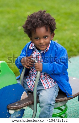 Outdoor Portrait Of A Cute Black Baby Boy Playing At Playground Stock ...