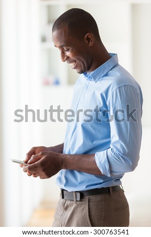 Portrait of a young African American business man using a mobile phone - Black people