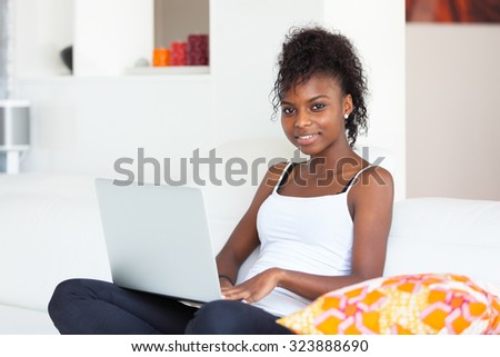 African American student girl using a laptop computer - black people