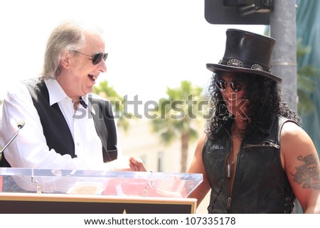 LOS ANGELES - JUL 10: Slash, Jim Ladd at a ceremony where Slash is honored with the 2,473rd Star on the Hollywood Walk of Fame on July 10, 2012 in Los Angeles, California