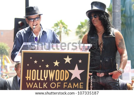 LOS ANGELES - JUL 10: Slash, Charlie Sheen at a ceremony where Slash is honored with the 2,473rd Star on the Hollywood Walk of Fame on July 10, 2012 in Los Angeles, California