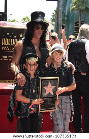 LOS ANGELES - JUL 10: Slash, son Cash, son London at a ceremony where Slash is honored with the 2,473rd Star on the Hollywood Walk of Fame on July 10, 2012 in Los Angeles, California