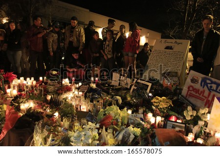 SANTA CLARITA - DEC 1: Fans pay tribute to actor Paul Walker at the site of his fatal car accident on December 1, 2013 in Santa Clarita, California