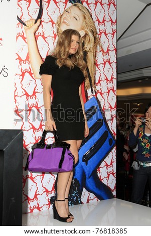 COSTA MESA - DEC 8: Stacy Ferguson aka Fergie launches her handbag collection for Kipling and signs autographs for her fans at Macy\'s in Costa Mesa, California December 8, 2007.