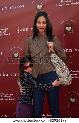 LOS ANGELES - MAR 13:  Zoe Saldana, niece Kayla arriving at the John Varvatos 8th Annual Stuart House Benefit at John Varvaots Store on March 13, 2011 in Los Angeles, CA