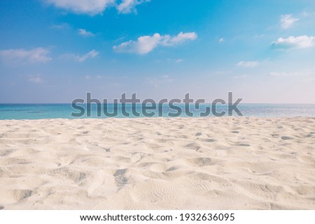 Closeup of sand on beach and blue summer sky. Panoramic beach landscape. Empty tropical beach and seascape. Orange and golden sunset sky, soft sand, calmness, tranquil relaxing sunlight, summer mood
