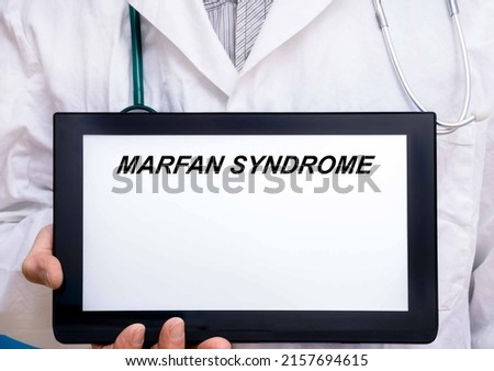 Marfan Syndrome.  Doctor with rare or orphan disease text on tablet screen Marfan Syndrome Imagine de stoc © 