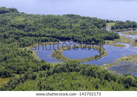 aerial landscape of lake and forest in northern quebec