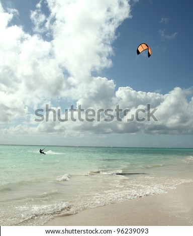 man kite surfing near the beach