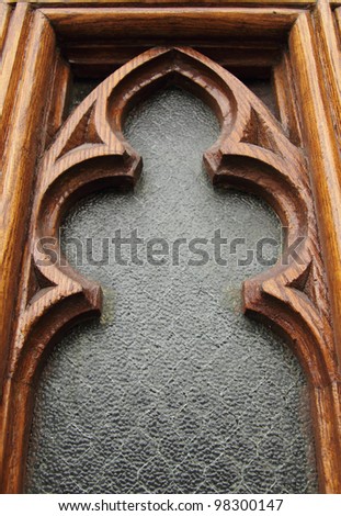 closeup of a church window with wood frame