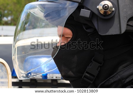 police officer in a protective helmet and visor, preparation for the demonstration