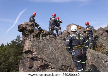 Stary Plzenec, Czech Republic, June 3, 2014: training rescue team. Rescue in rocky terrain near the castle RADYNE.