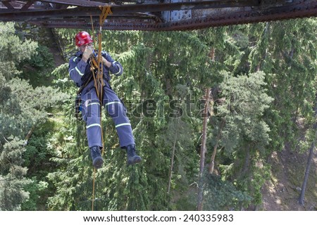 Pnovany, Czech Republic, June 4, 2014: Training elevation work on the old railway bridge over the dam Hracholusky, rescue work on the construction of the bridge