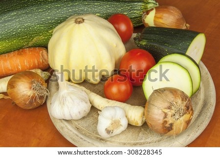 Growing vegetables in the organic farm. Vegetables grown in a small home garden. . Background with vegetables. Promotion of healthy diets, diet food preparation.