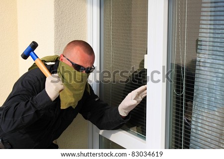 Thief With A Hammer Smashing A Glass Door Stock Photo 83034619 ...