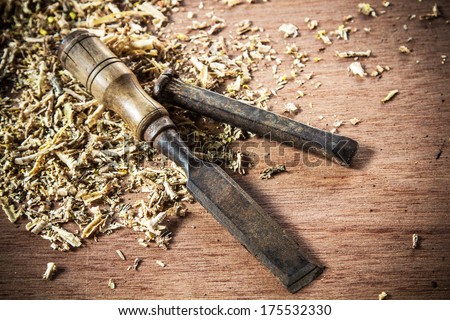 the old chisel in wooden work shop