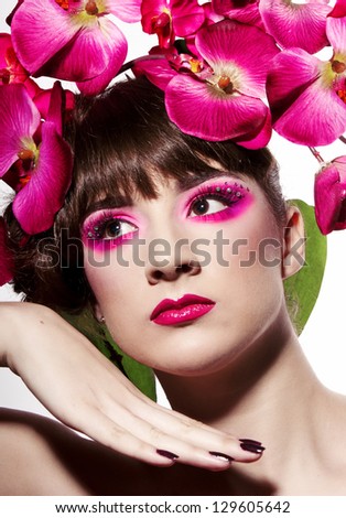 Perfect girl with orchid in her hair