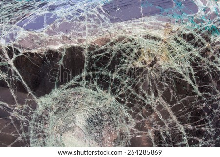Close up background texture of cracked windshield damage from car accidents.