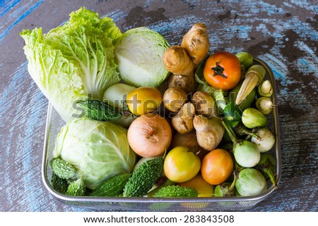 Various types of vegetables on a basket of stainless steel in the shop, one of Thailand.