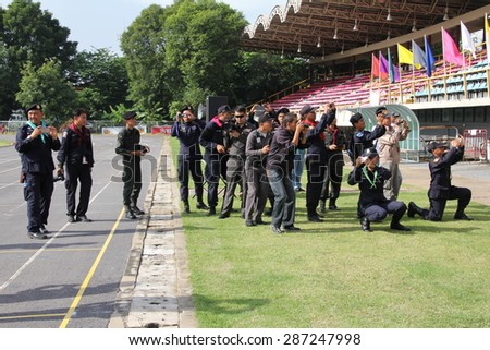 BANGKOK THAILAND-JULY 9:\
Groups of photographers and journalists, the police are shooting on the turf and running track.On July 9, 2013 in Bangkok, Thailand.