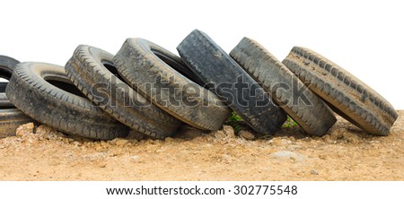 Isolate the line long been used tires of cars, which are stacked on the ground.