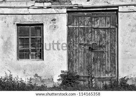 old door and window of brick building