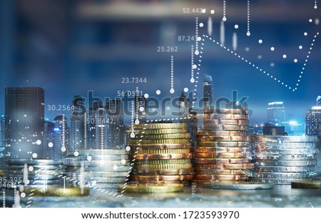 Double exposure of coins stack with graph chart and night cityscape. Economic, business, financial and stock market growth concept. ストックフォト © 
