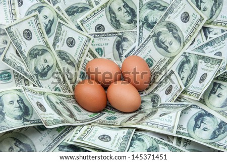 Egg nest of hundred dollar bills.