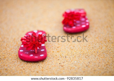 red shoes on the sand