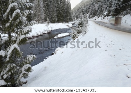 Mountain Winter Driving, British Columbia. A mountain Highway through Manning Park in the Cascade Mountains in winter. The Skagit River flows alongside.