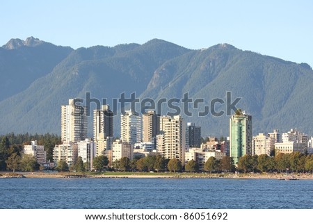 The view across English Bay, the apartments and condominiums of the West End, and the North Shore Mountains in Vancouver. British Columbia, Canada.