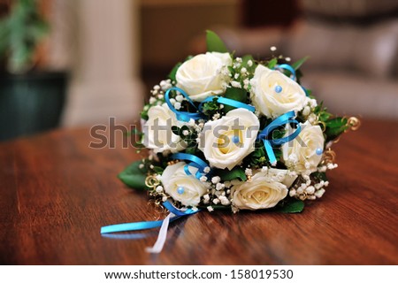 wedding bouquet on the wooden table