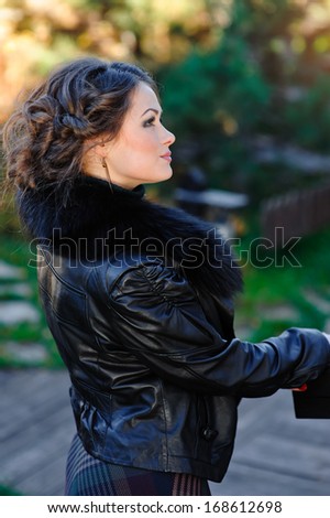 Profile of beautiful girl outdoors