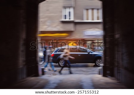hurrying people in the city streets.