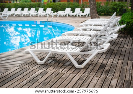 loungers by the pool at the recreation center.