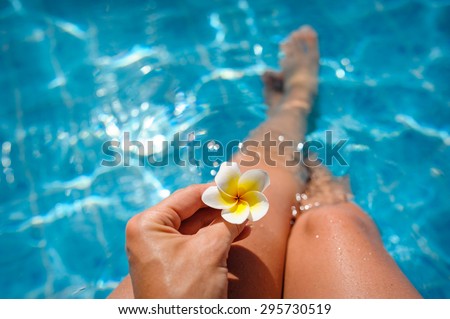 beautiful woman with a white flower in hand
