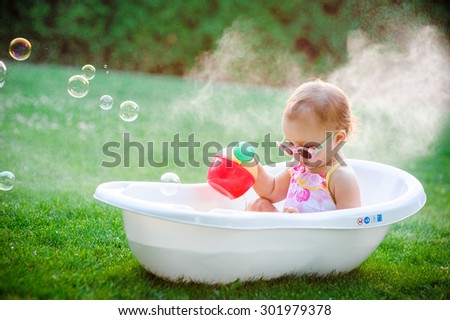 child bathing  with foam bath.