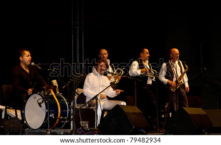 SIBIU, ROMANIA - JUNE 16: Goran Bregovic and His Wedding And Funeral Orchestra performs on stage at International Movie Festival on June 16, 2011 in Sibiu, Romania