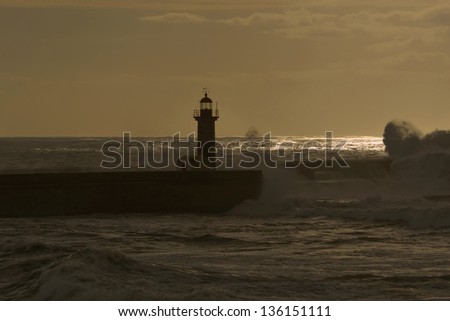 In a winter day the waves hit hard in the lighthouse
