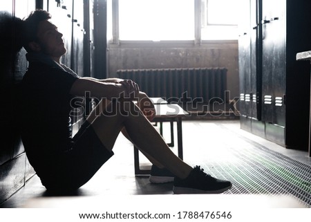 Image, Stock Photo Athletic caucasian man sitting on bed of massage salon