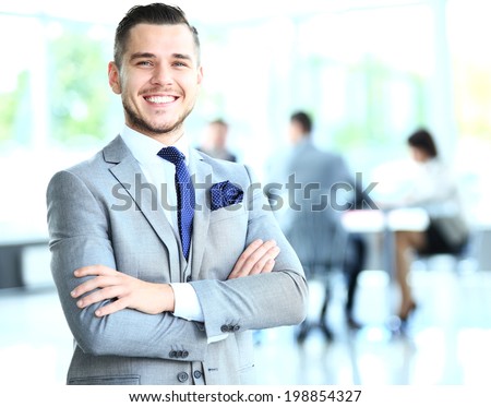 Businessman with colleagues in the background