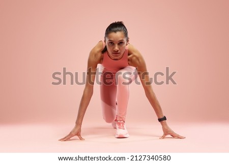 Similar – Image, Stock Photo Attractive sportswoman standing and listening music on the street