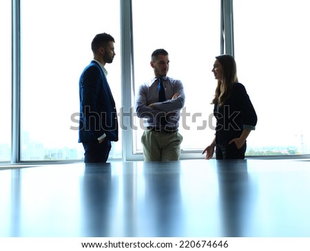 Shady image of a manager discussing business matters with his subordinates