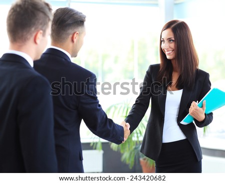 Business people shaking hands, finishing up a meeting
