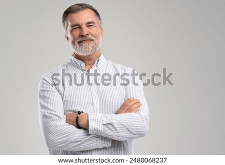 Similar – Image, Stock Photo Photo of serious and confident bearded hispanic man with hand on chest promising oath isolated over blue colored background.